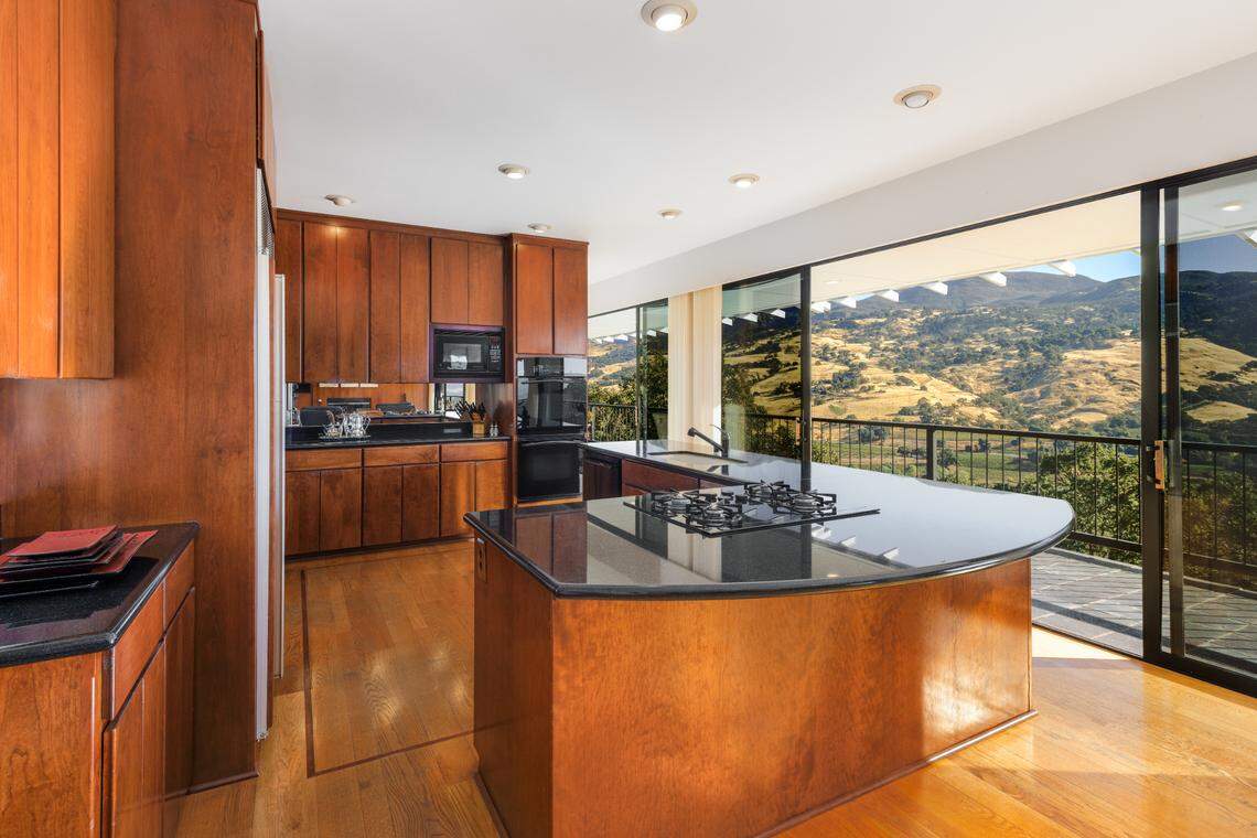 The kitchen, and most rooms, in the Mendocino County wine country estate has views looking out over the 100-acre property.