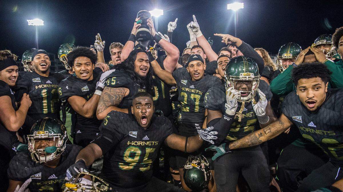 Sacramento State players celebrate their victory over UC Davis in the 64th Causeway Classic on Nov. 18, 2017, at Hornet Stadium in Sacramento. The status for this year’s game, scheduled for Saturday, is up in the air due to smoke from the Camp Fire.