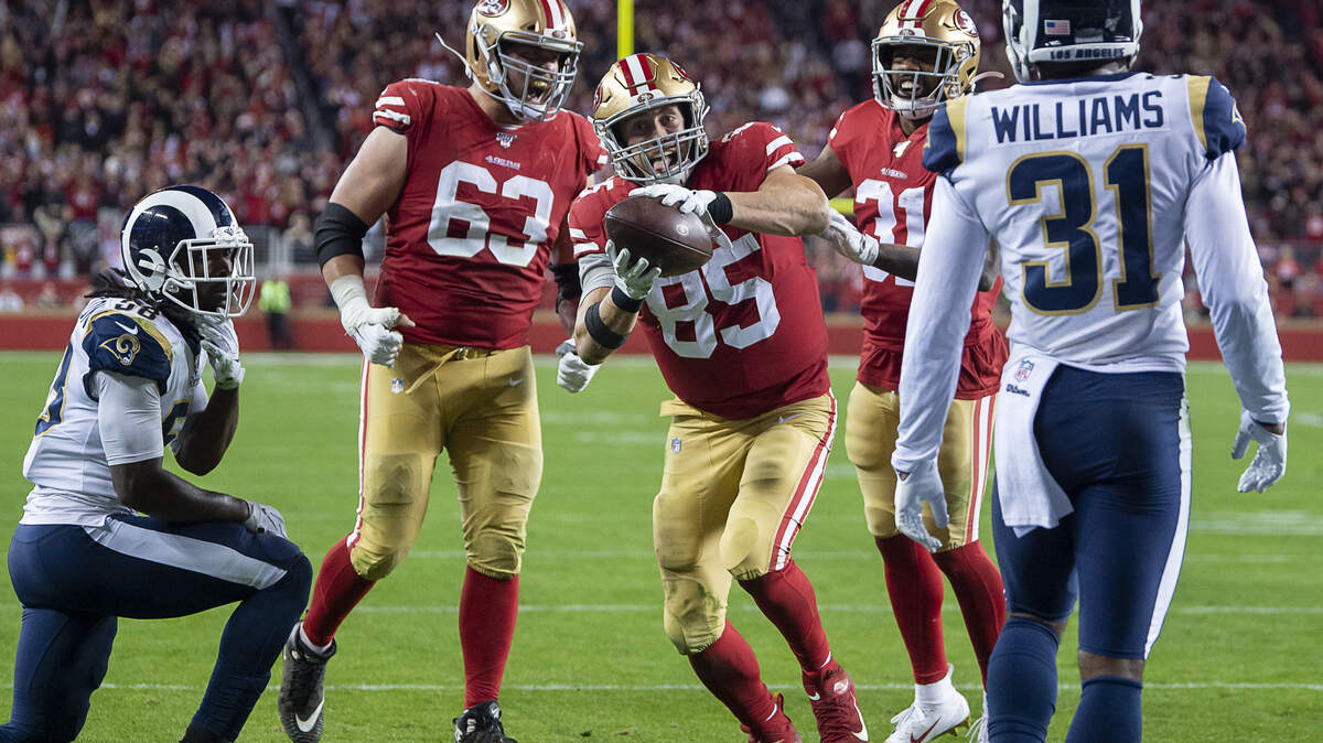 San Francisco 49ers tight end George Kittle (85) celebrates scoring a touchdown in the fourth quarter with San Francisco 49ers offensive guard Ben Garland (63) and San Francisco 49ers running back Raheem Mostert (31) in the fourth quarter during a game against the Los Angeles Rams at Levi’s Stadium on Saturday, December 21, 2019 in Santa Clara, Calif.