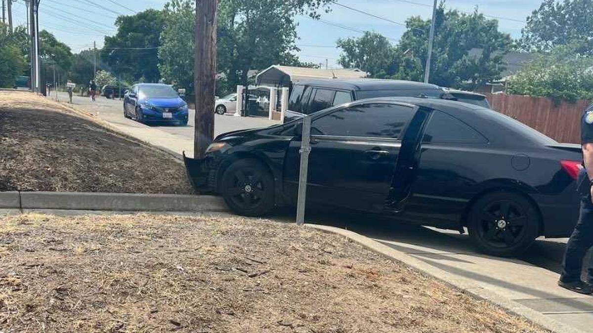 A Toyota Corolla rests after a 13-year-old driver allegedly stole and crashed it near Raley Boulevard and Youngs Avenue in North Sacramento on Monday, June 5, 2023. Deputies detained the driver and two other juveniles suspects that were in the vehicle.