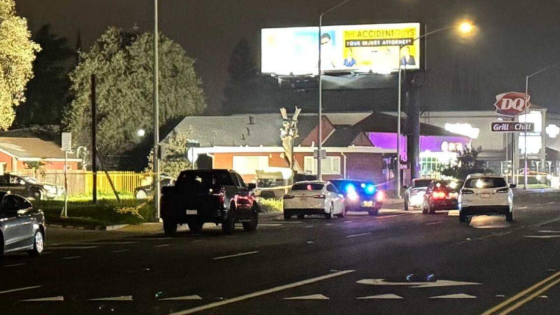 Law enforcement is seen near the site of a mass shooting near Stockton on Saturday.