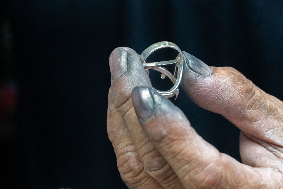 Bunn Lorn with Bunn & Son Jewelers repairs a ring during the Gem Faire at the Scottish Rite Masonic Center in Sacramento on Friday, Aug. 2, 2024. Lorn polished and set stones into rings throughout the day.