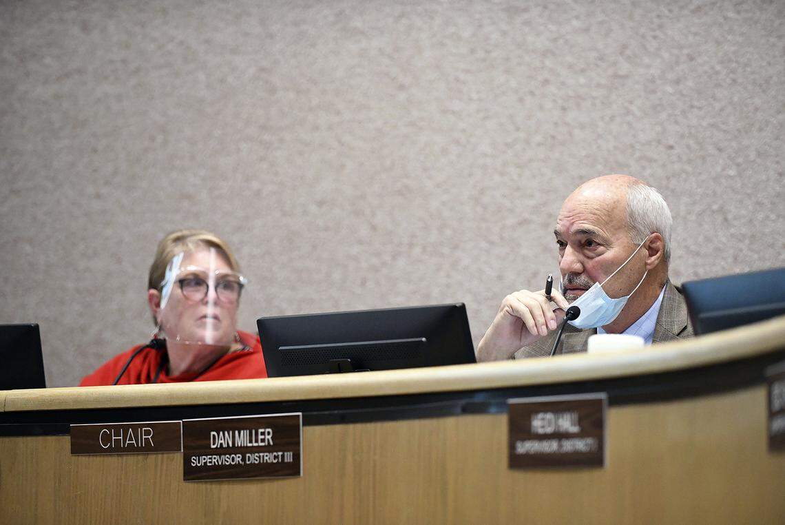 Nevada County Board of Supervisors chairman Dan Miller listens to members of the audience during an in-person meeting in December in Nevada City. Many members of the audience came to demand the board be removed and replaced.