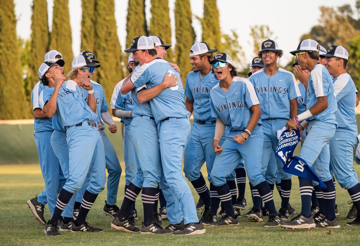 The Oakmont Vikings celebrate their newly won CIF Sac-Joaquin Section Division IV high school baseball title after defeating the Woodland Wolves on Wednesday, May 24, 2023, at Sacramento City College.