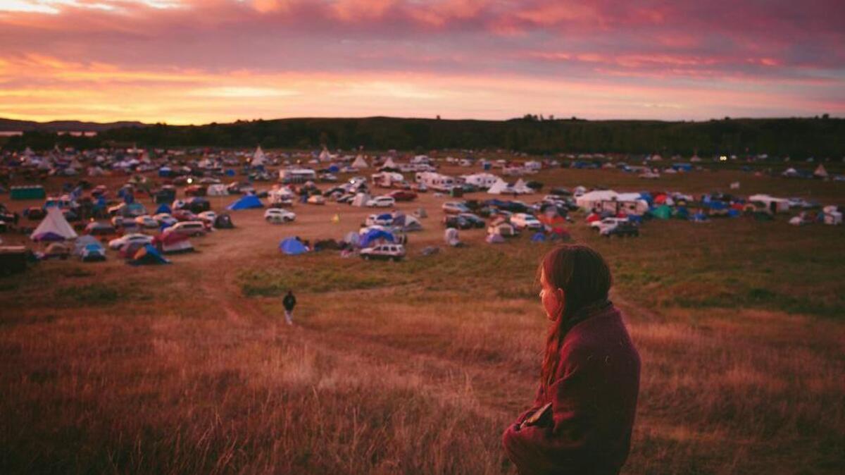 Susan Leopold of the Patawomeck Tribe of Virginia watches the sun rise over a protest camp in Cannon Ball, N.D., in September.