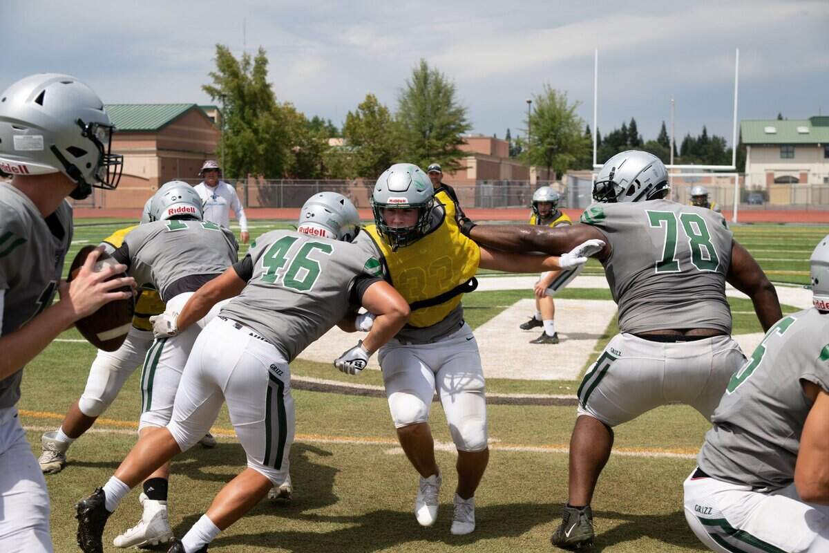 Granite Bay football players, including Beck Wolber (46), Broc Daily (33), in vest, and Zaire Collier (78), practice drills at the high school in Granite Bay earlier this month. Teams are reducing contact in practices to avoid injuries and concussions.