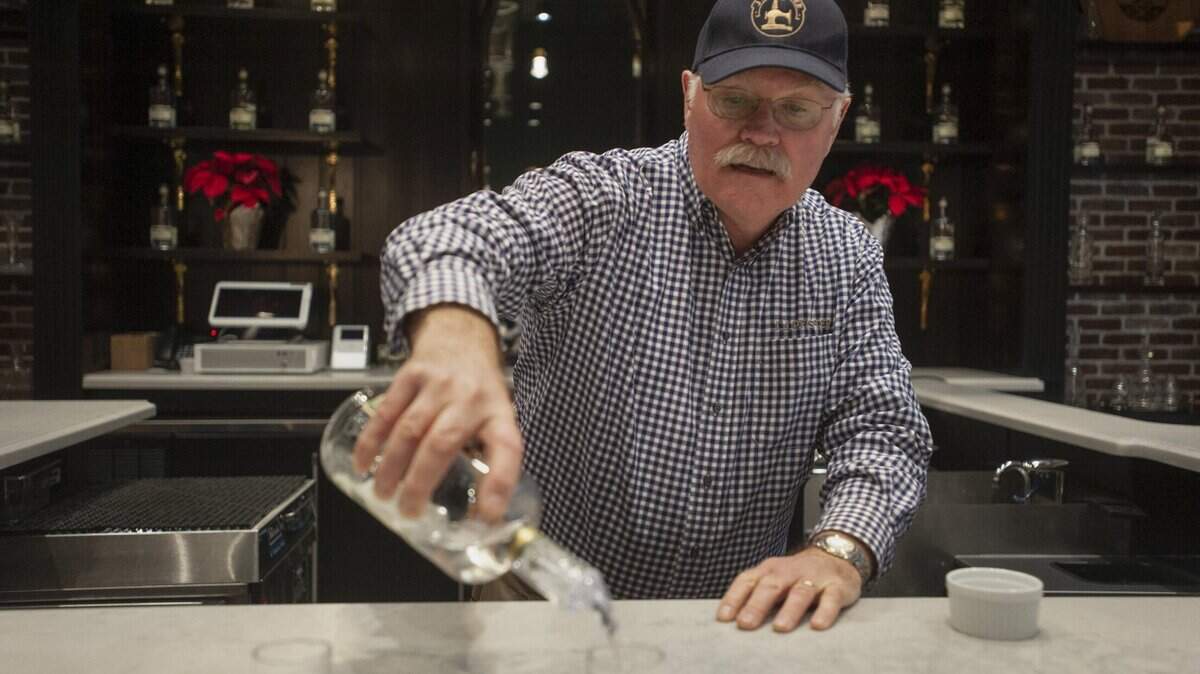 Kevin Keck pours gin at J.J. Pfister Distilling, a craft distillery in Rancho Cordova, which produces gin, potato vodka, and whiskey.
