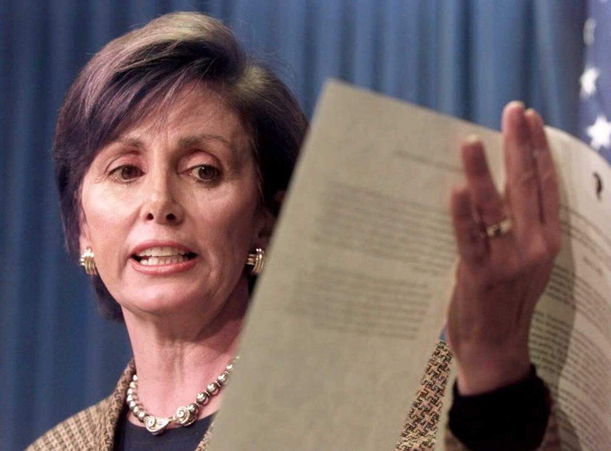 Congresswoman Nancy Pelosi, D-Calif, describes, during a May 8, 1996, Capitol Hill press conference in Washington, sections of her bill sanctioning China for violating US copyrights. Pelosi is urging President Bill Clinton to pressure China to live up to its agreement to protect U.S. software.