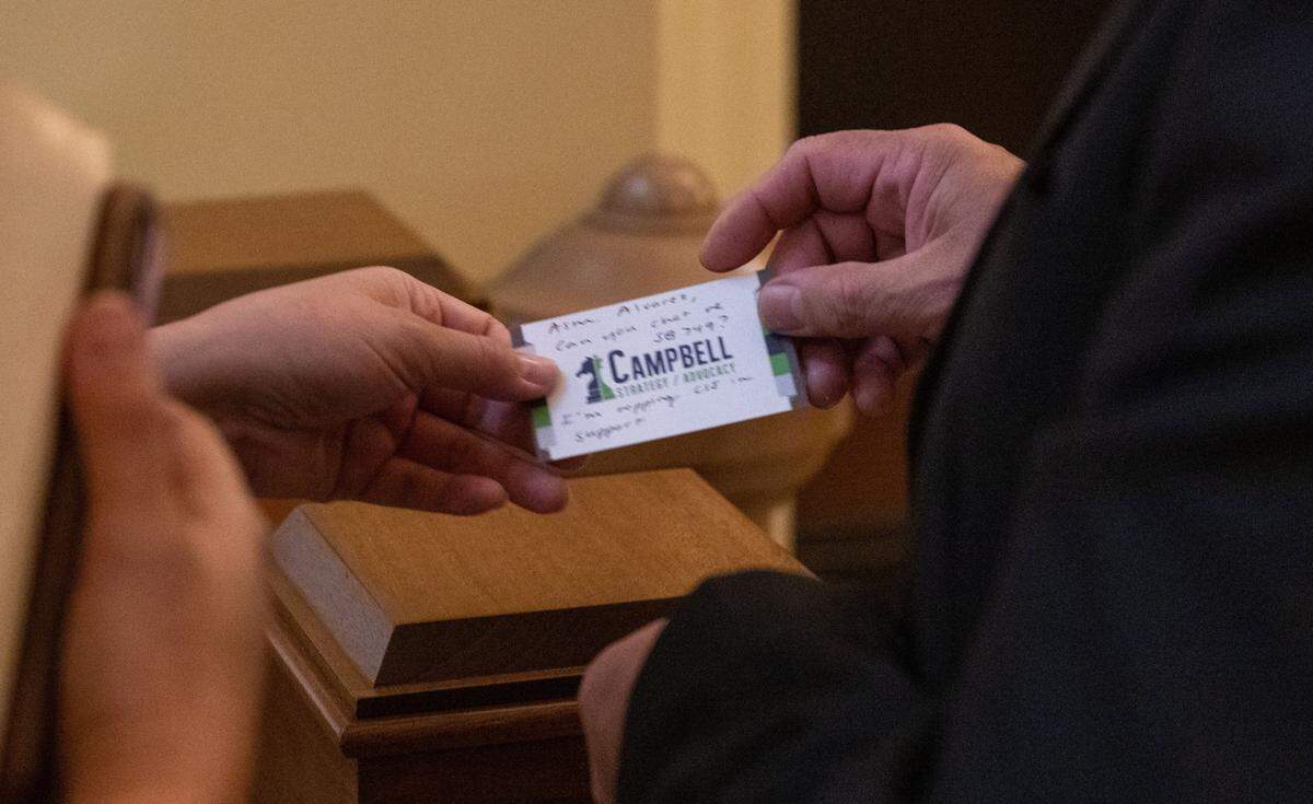 A lobbyist for Campbell Strategy/Advocacy turns in a card in 2023 for an assemblymember that was returned because it had a message of support of a bill, which is prohibited by the chamber’s rules.