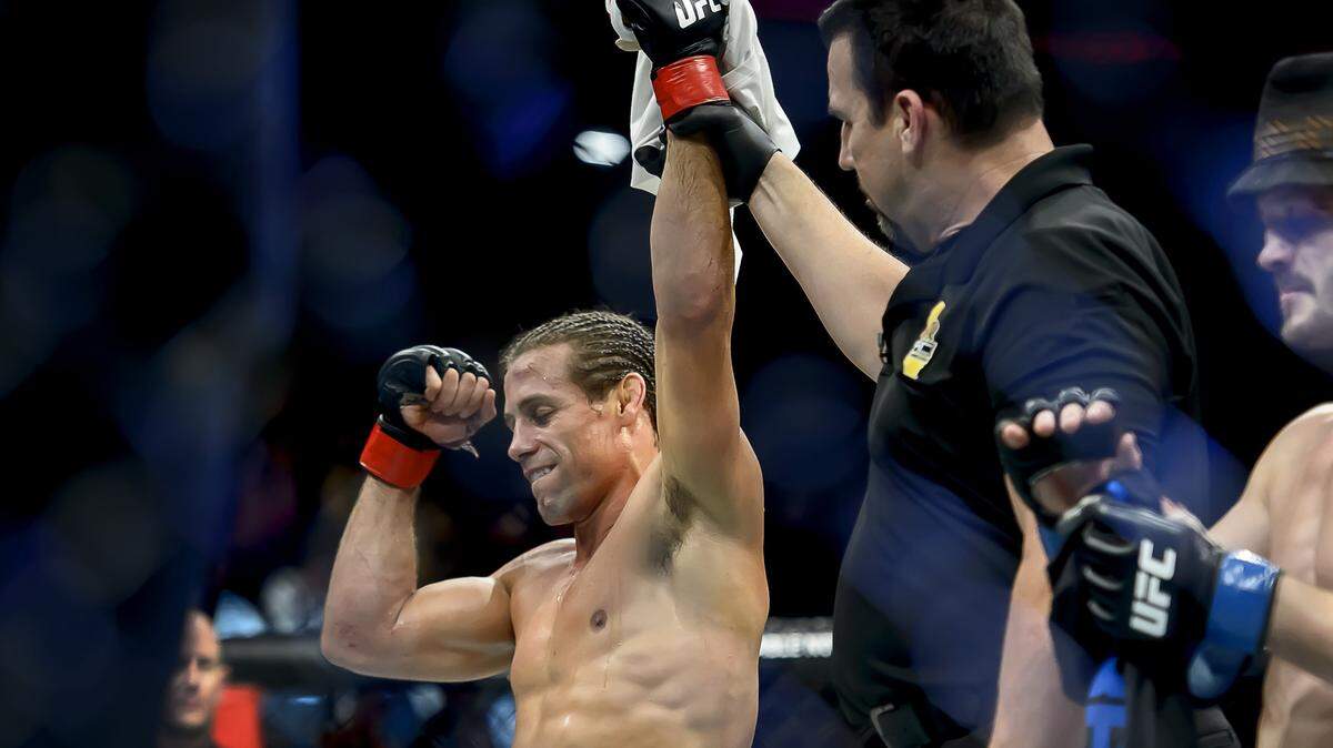 Urijah Faber celebrates after winning a fight over Brad Pickett in their UFC bout at the Golden1 Center, Saturday Dec 17, 2016.