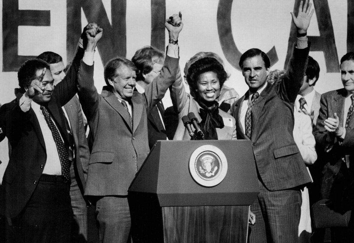 A crowd of some 10,000 jammed the K Street Mall to see President Jimmy Carter give a boost to Democrat­ic office-seekers on Nov. 3, 1978. He is joined on stage by Lt. Gov. Mervyn Dymally, left, Attorney General candidate Yvonne Braithwaite Burke, at podium, and Gov. Jerry Brown, right.