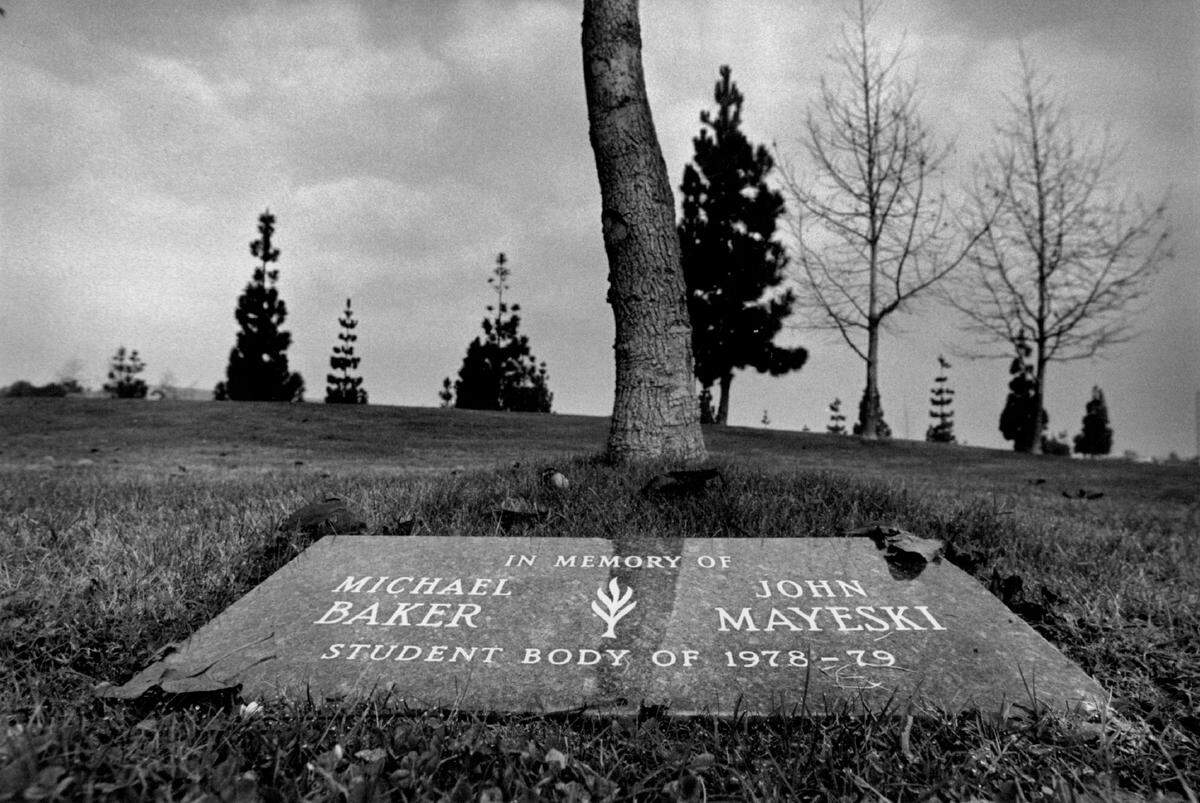 This is a memorial at Mira Mesa H.S. (near San Diego) that was placed on the school grounds by students. Also a tree (center) was planted in their honor. The two students, John Mayeski and Michael Baker, both 16, were murdered by Richard Alton Harris just a few miles from the school.