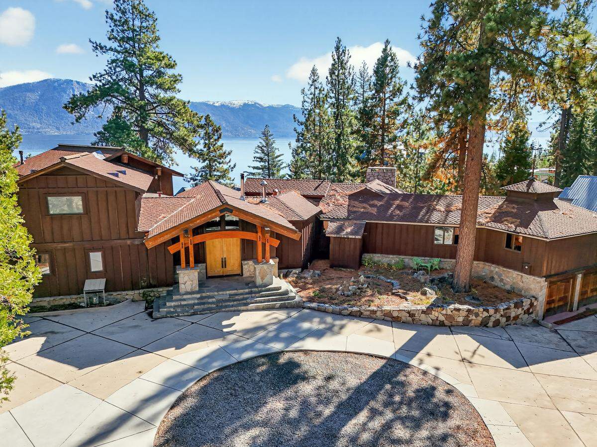 Set on nearly an acre at 16 and 20 Cal Neva Drive, the estate includes the main residence and three guest cottages – totaling 9,877 square feet, nine bedrooms and 10 full baths.