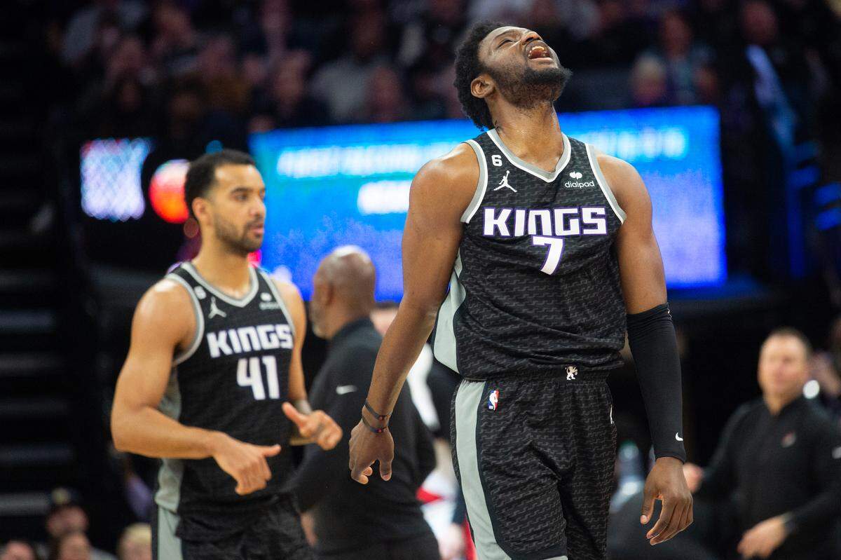 Sacramento Kings forward Chimezie Metu (7) reacts as he walk to the bench during a time out in the fourth quarter during a game at Golden 1 Center in Sacramento, Thursday, Feb. 23, 2023.
