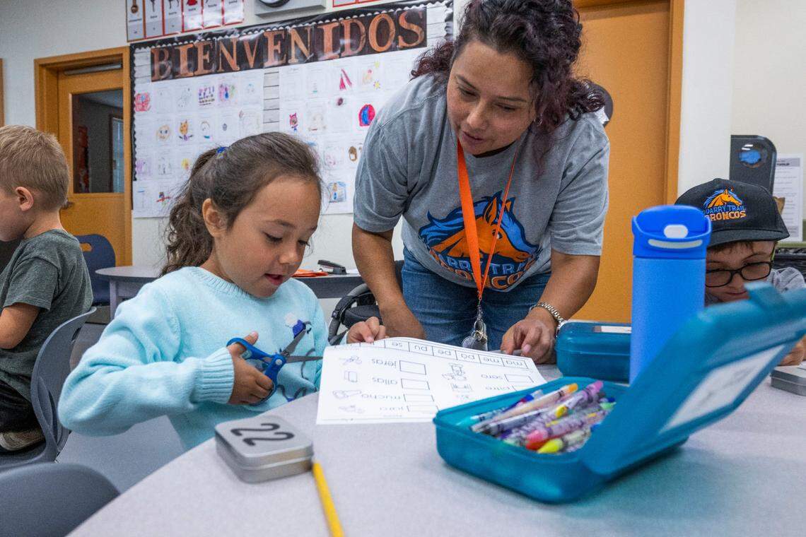 Veronica Cuéllar-López, right, a kindergarten teacher at Quarry Trail Elementary School, works with Lilly Radillo on Spanish syllables in the dual-language immersion program earlier this month. After years of English-only education in California, there is a new era of bilingual education.