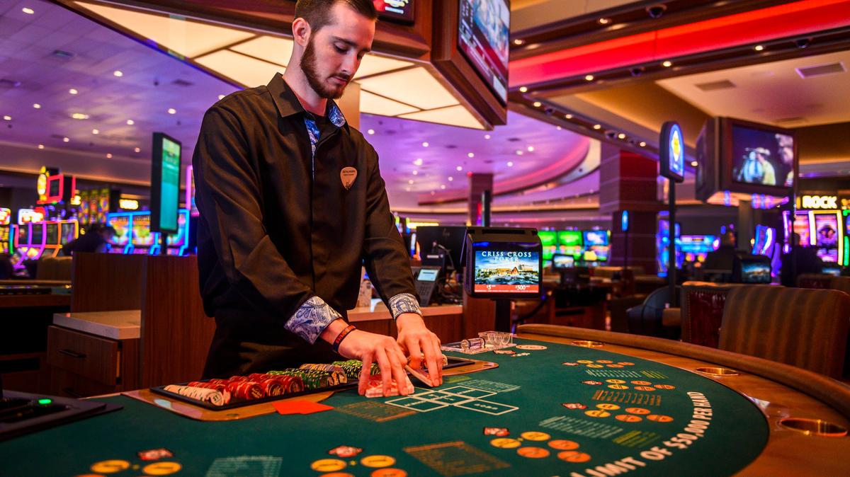 Criss Cross poker dealer Ben Mayer shuffles cards as he waits for customers at the Hard Rock Casino Sacramento in Wheatland on Tuesday, Feb. 25, 2020.