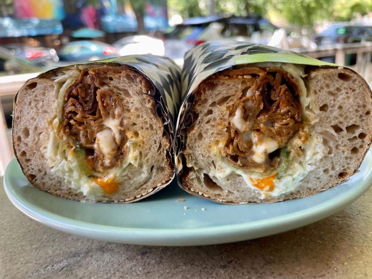 Pizza Supreme Being’s non-pizza options include a lamb chopped cheese sandwich on housemade bread.