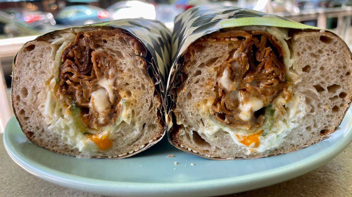 Pizza Supreme Being’s non-pizza options include a lamb chopped cheese sandwich on housemade bread.