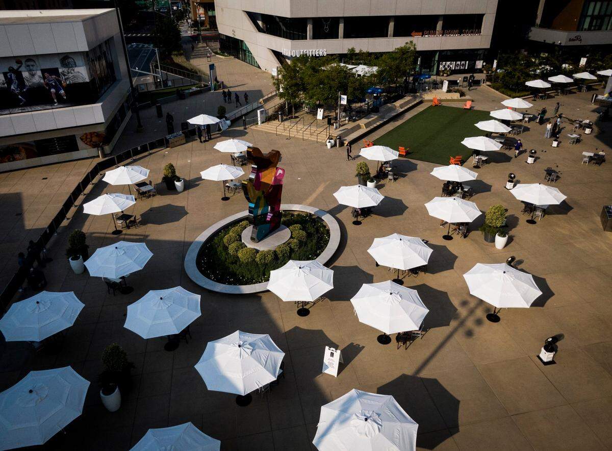 Umbrellas line Downtown Commons in September 2020. Thursday’s draft viewing party will be a big moment for the city — the chance to have thousands of people milling around downtown, spending money in restaurants and bars, like they did before the COVID-19 pandemic struck last year.