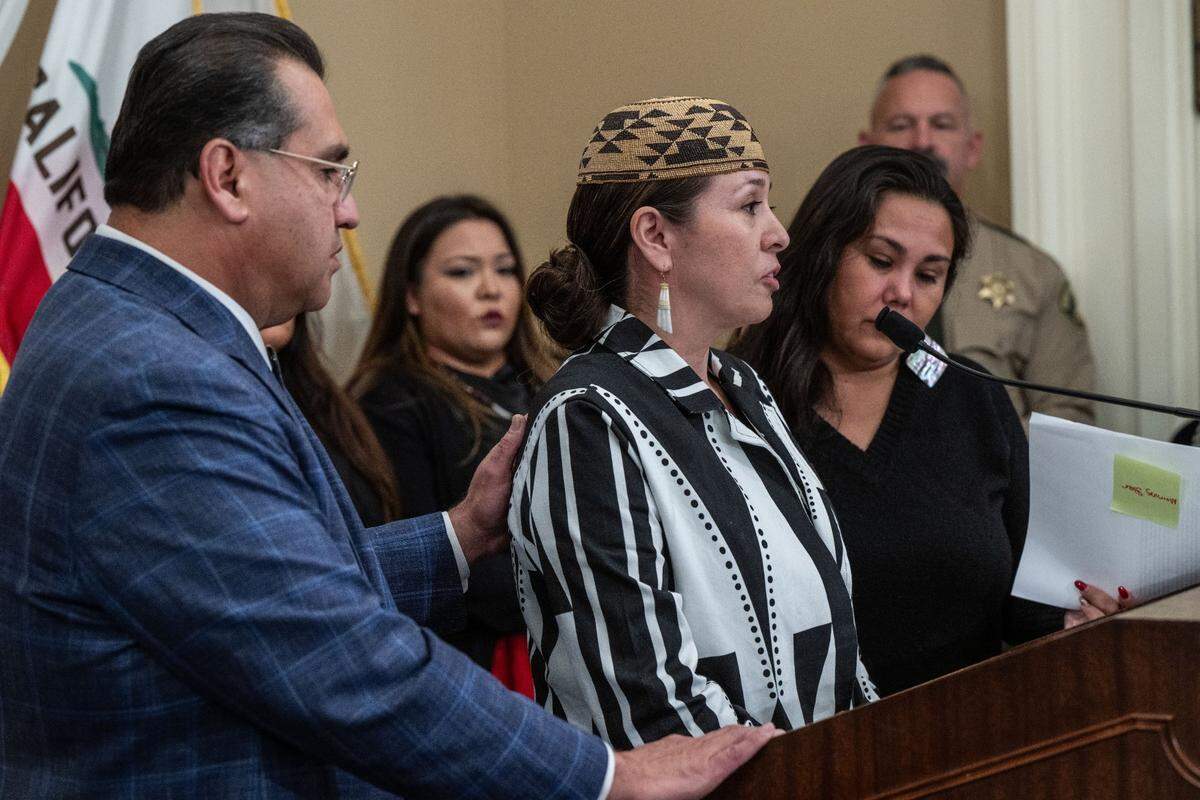 Assemblyman James Ramos, D-San Bernandino, comforts Yurok tribal member Taralyn Ipiña on Wednesday, Jan. 24, 2024, talks during a press conference at the state Capitol about the state’s Feather Alert emergency notification system for missing Native Americans.