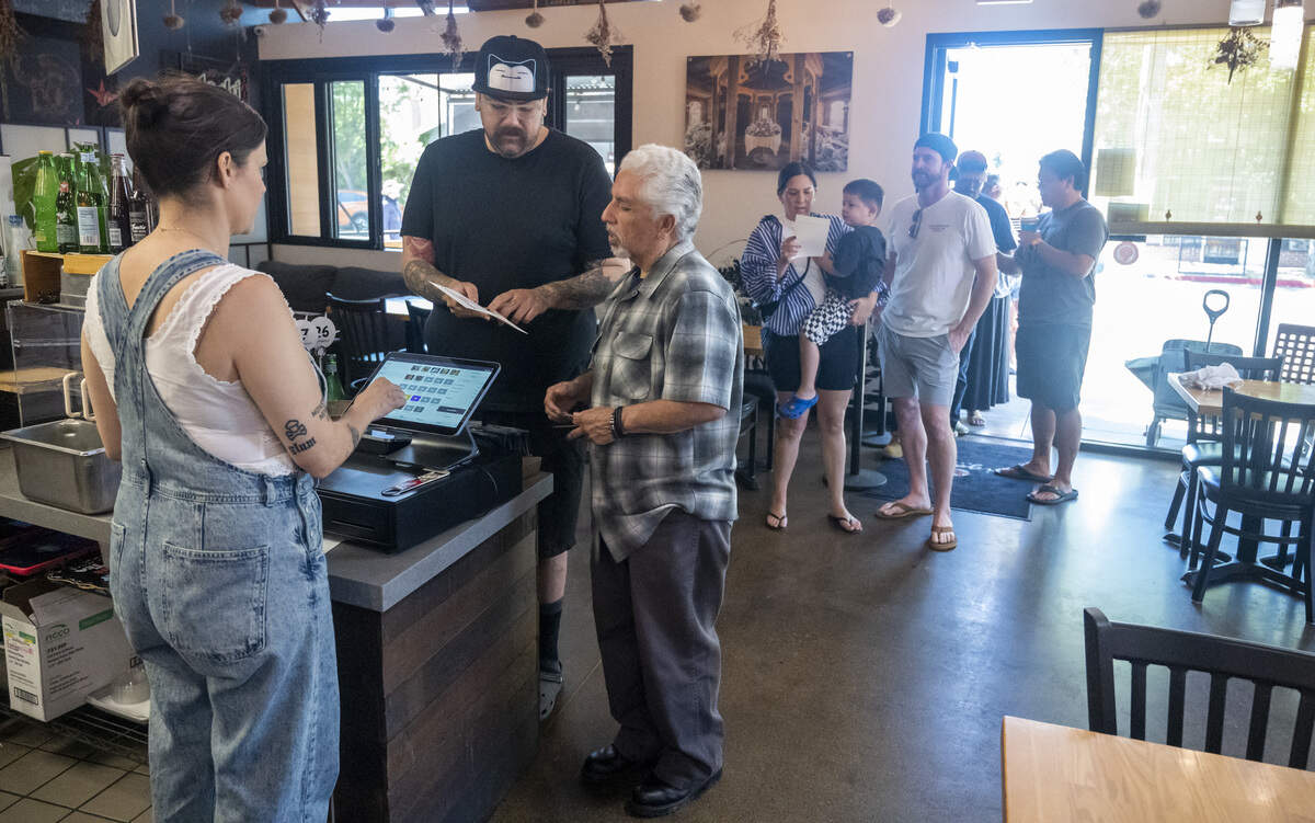 Customers wait in line to order at Bocce’s pop-up event at Origami Asian Grill in Sacramento on Sunday, June 7, 2026.
