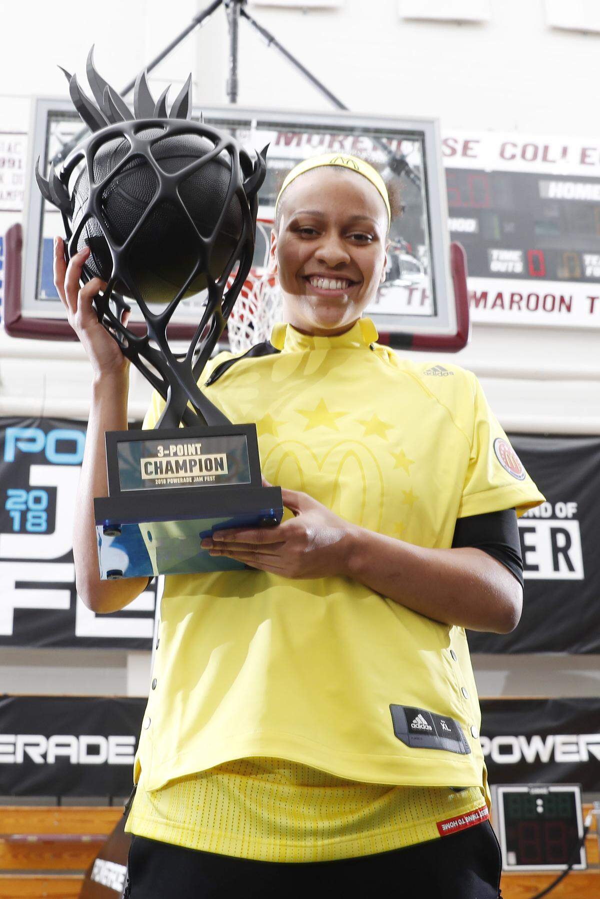 Folsom High School senior McKenzie Forbes holds her trophy after winning the 3-point contest at the McDonald's All-American showcase on Wednesday, March 28, 2018, in Atlanta.