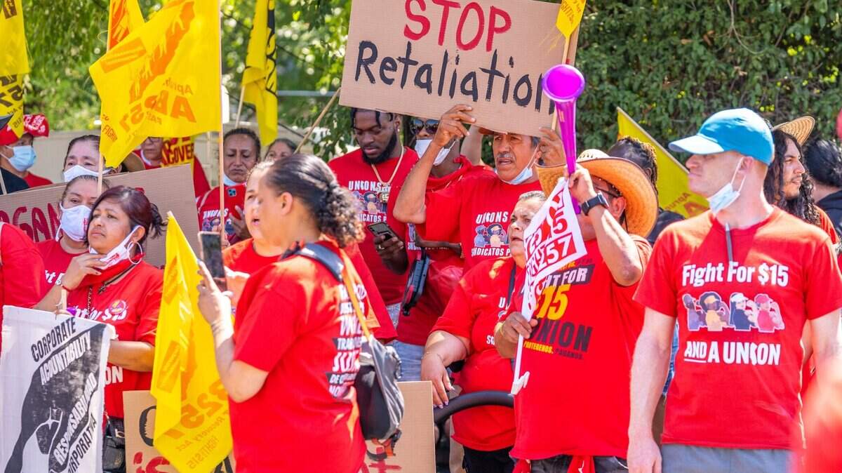 Protesters line up outside of a McDonald’s in North Highlands on Tuesday, Aug. 16, 2022, to show their support for a California bill that will strengthen fast food workers’ rights.