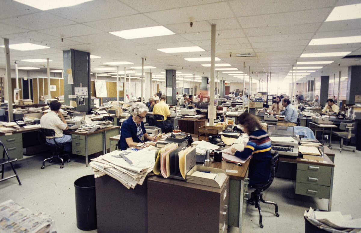 Staffers work in The Sacramento Bee newsoom on Q Street in 1976. 