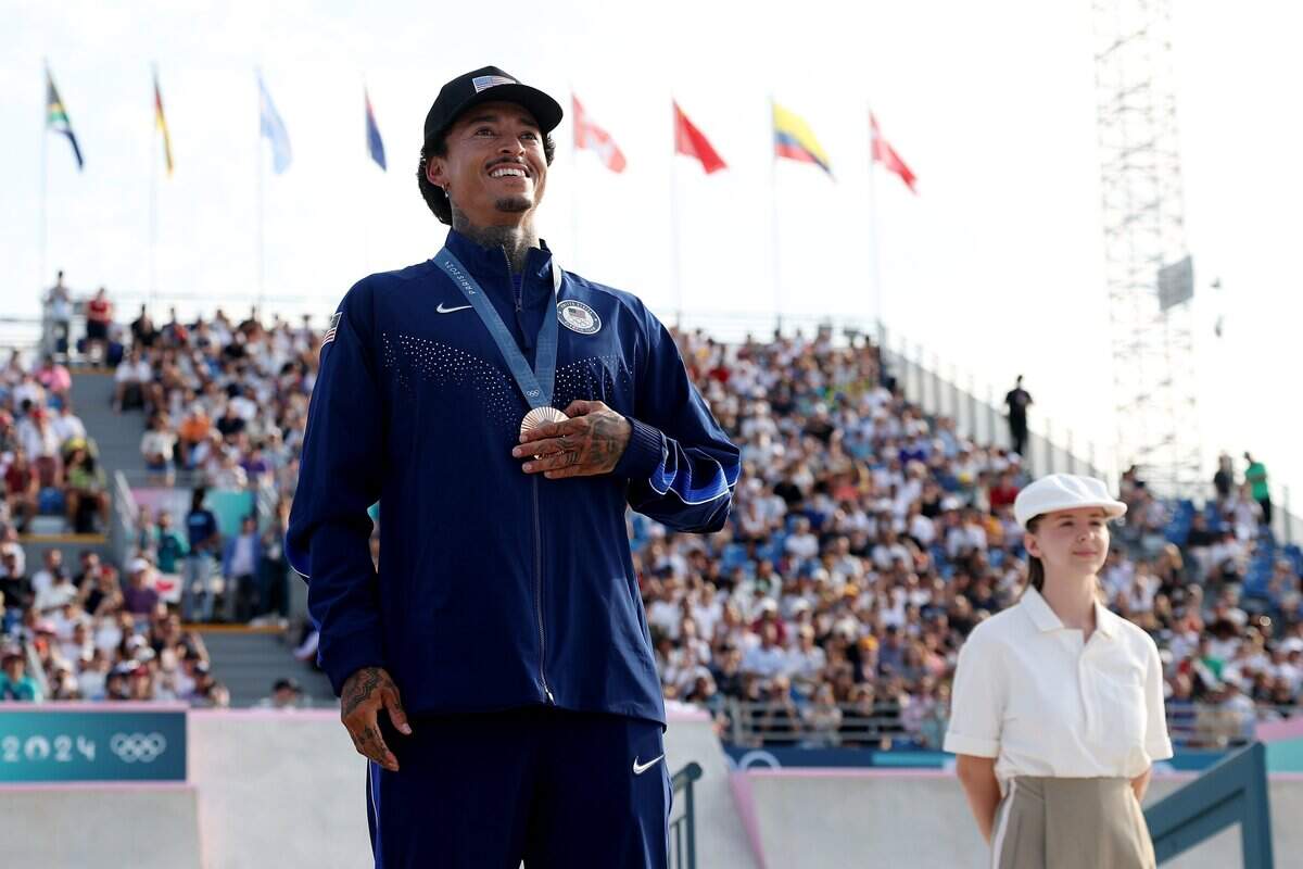 PARIS, FRANCE - JULY 29: Bronze medalist Nyjah Huston of Team United States poses on the podium during the Men's Street Finals on day three of the Olympic Games Paris 2024 at Place de la Concorde on July 29, 2024 in Paris, France. (Photo by Cameron Spencer/Getty Images)