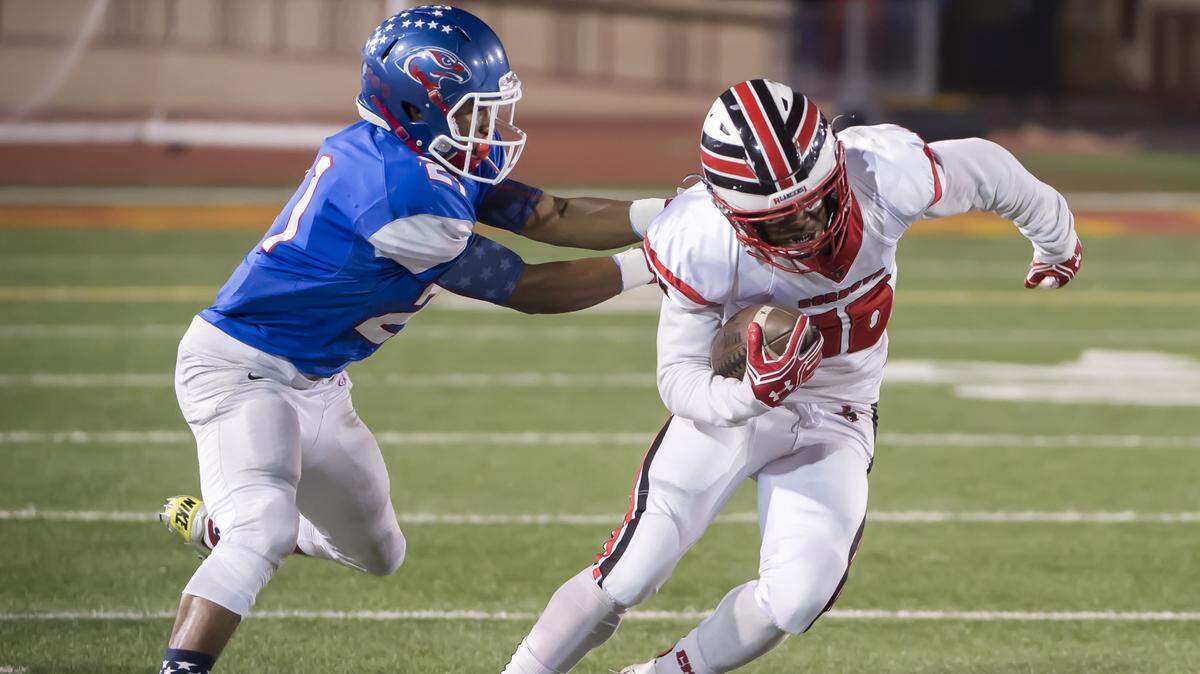 Christian Brothers’ Jamarri Jackson tackles Cordova’s Alvin Banks during a Sac-Joaquin Section Division I football playoff game at Hughes Stadium,  Nov. 11, 2016.