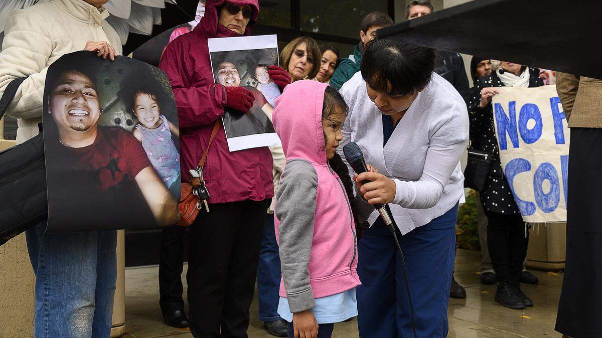 Julissa Nambo, 5, speaks to the public with her mom, Maria, outside of the Sacramento Sheriff’s Office on Wednesday, Dec. 4, 2019, during a press conference protesting the transfer of her father, Enrique Nambo, from the Sacramento jail to ICE officials.