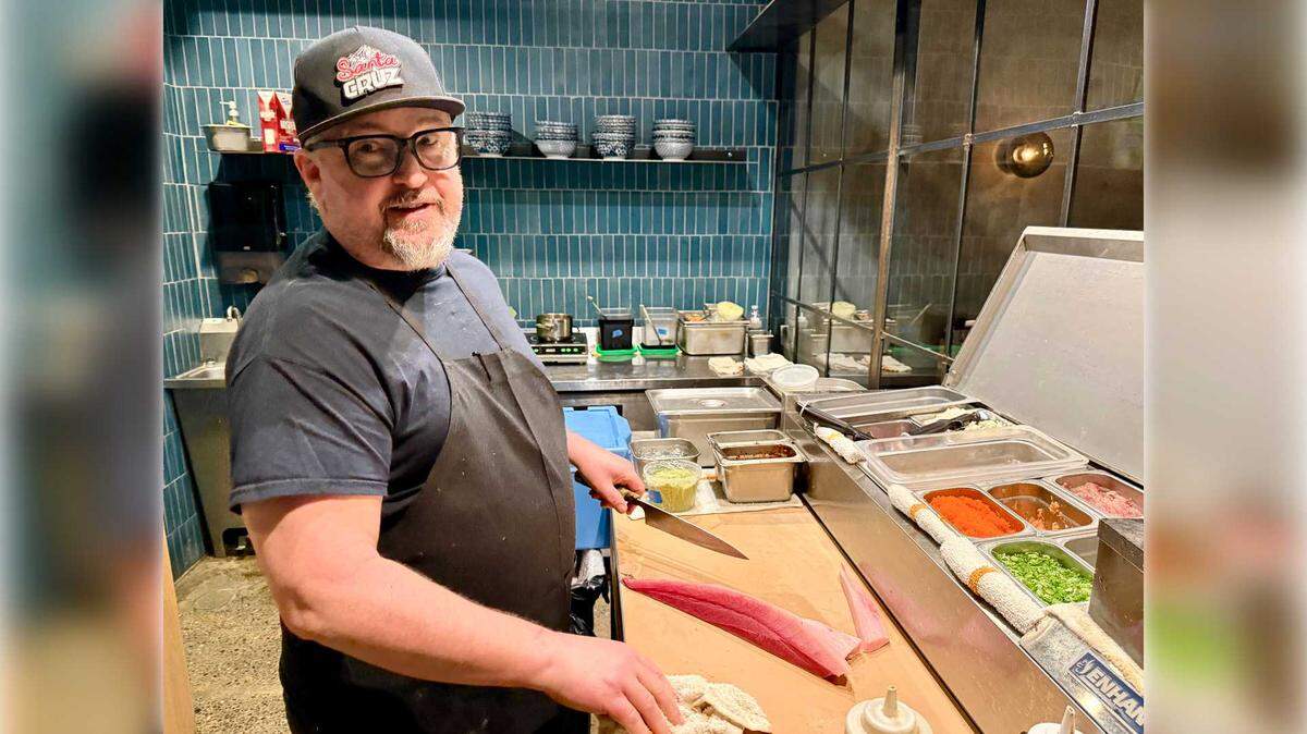 Lou Valente of Lou's Sushi prepares fresh ahi tuna for diners in his newly rebooted restaurant in the MARRS Building in midtown. Valente opened his restaurant on Friday, Jan. 23.