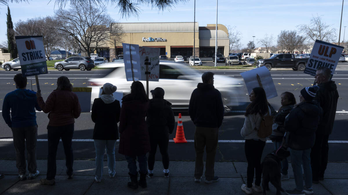 Striking medical workers wave signs outside Kaiser Permanente’s Roseville Medical Center in Roseville on Monday, Jan. 26, 2026.