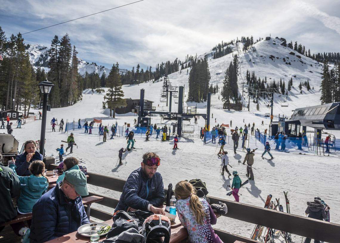 Families eat lunch outside while skiers and snowboarders prepare to hit the slopes at Sugar Bowl Ski Resort in Febuary 2020, when the state’s snowpack was at 53% of normal.
