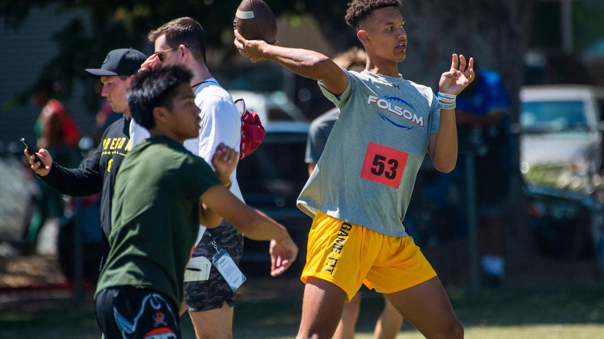 Folsom High School’s Austin Mack passes the ball on Wednesday during a high school football skills camp at Sacramento State, where players go through drills under the eye of college coaches from across the country.