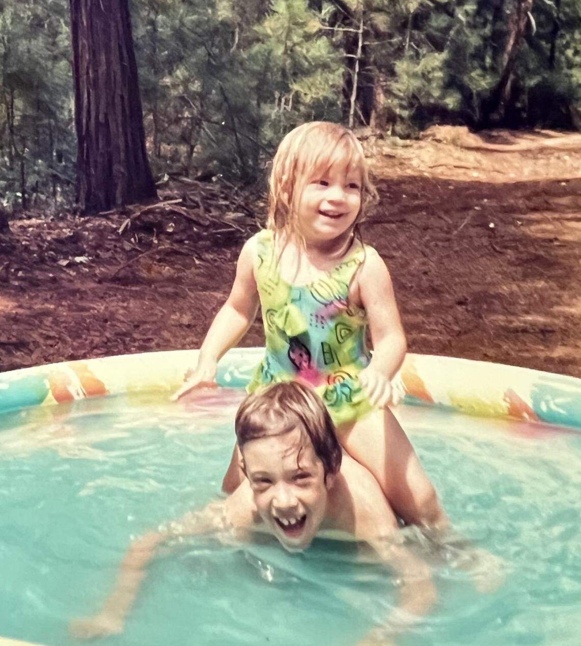 Aaron Ward and his sister, Sara, play as children.