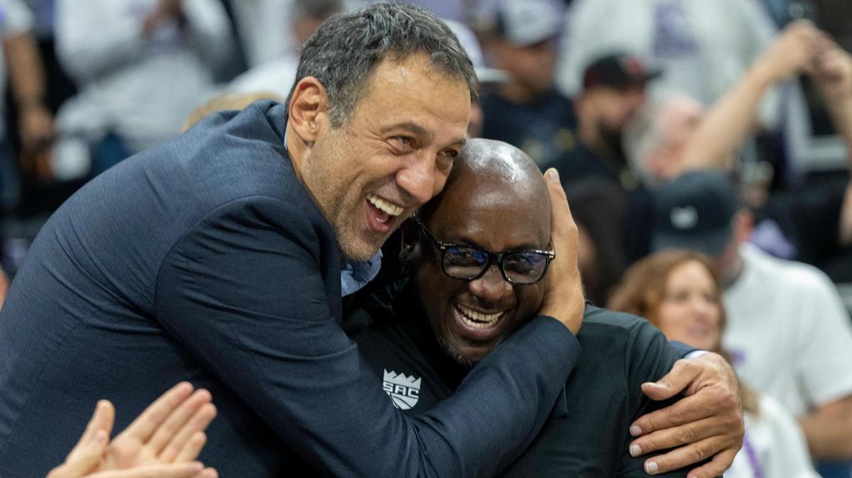 Former Sacramento Kings player and general manager Vlade Divac hugs former Kings player Bobby Jackson, who now coaches the Stockton Kings, during Game 1 of the first-round NBA playoff series at Golden 1 Center on Saturday.