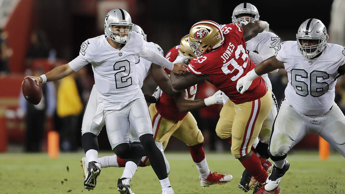 D.J. Jones (93) of the 49ers moves in on Raiders backup quarterback AJ McCarron (2) on Nov. 1 in Santa Clara. The athletic Jones has a good chance to be San Francisco’s starting nose tackle next season.