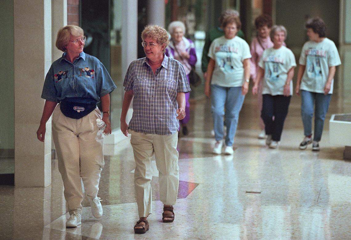 Yvonne Benjamin, left, and Laura Zandenbosch, right, make their way around the inside of Sunrise Mall in 1998.
