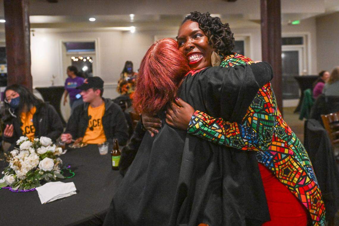 Sacramento mayoral candidate Flojaune Cofer hugs a supporter at during her election night party at Our Place in Old Sacramento on March 5.