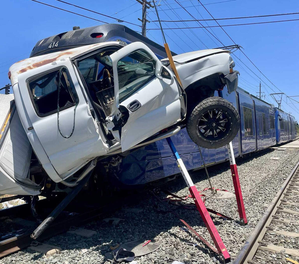 A Chevrolet Silverado is seen wedged against the front of a Sacramento Regional Transit light rail train after a collision in Rancho Cordova on Friday, July 3, 2026. The cause of the crash remains under investigation.