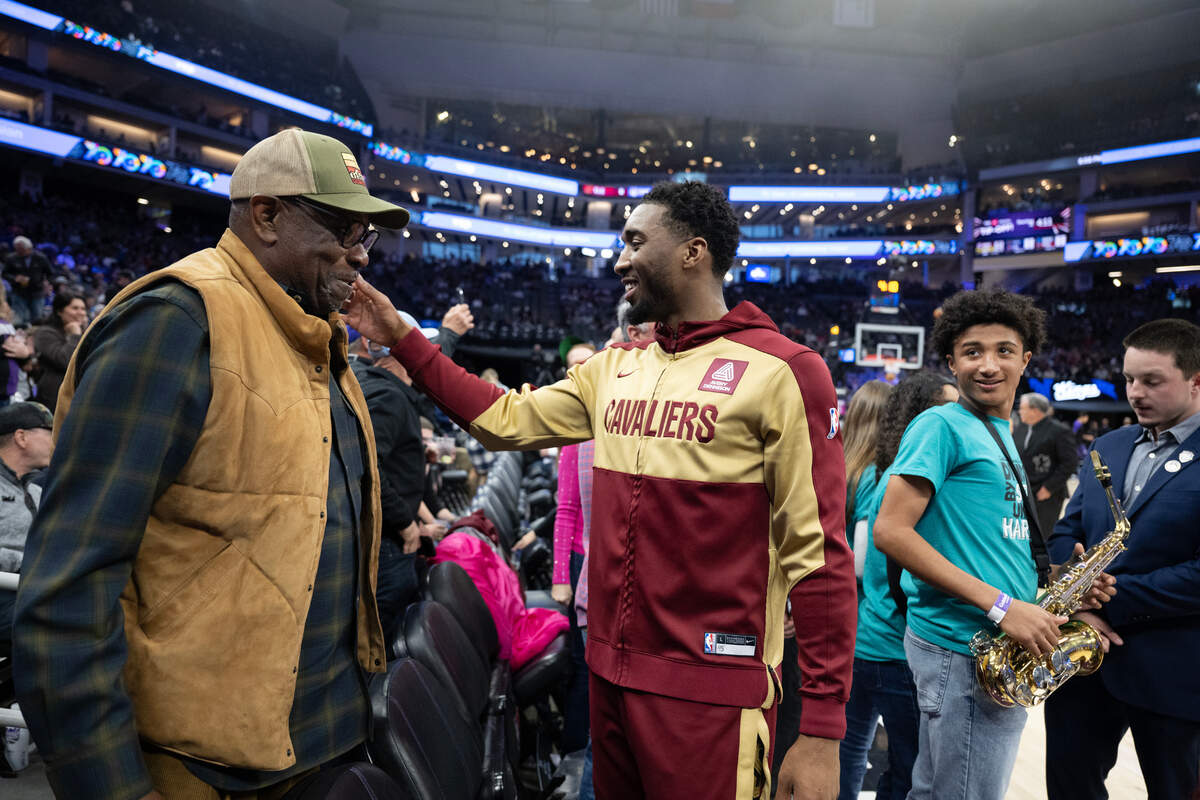 Former MLB manager Dusty Baker meets with Cleveland Cavaliers guard Donovan Mitchell before Wednesday’s game against the Sacramento Kings on March 19, 2025 at Golden 1 Center.
