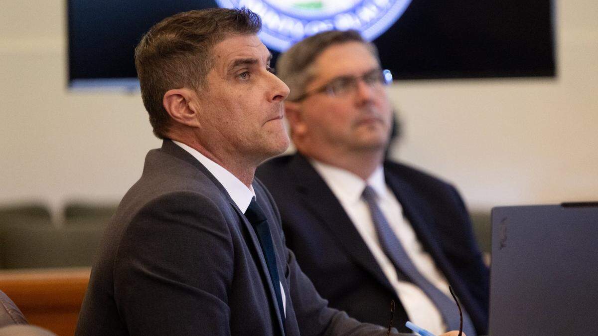 Daniel Serafini, the former major league baseball player who is on trial for the murder of his in-laws, listens to the opening arguments by the prosecution with his attorneys David Dratman and David Fischer in Placer Superior Court in Auburn on Monday.