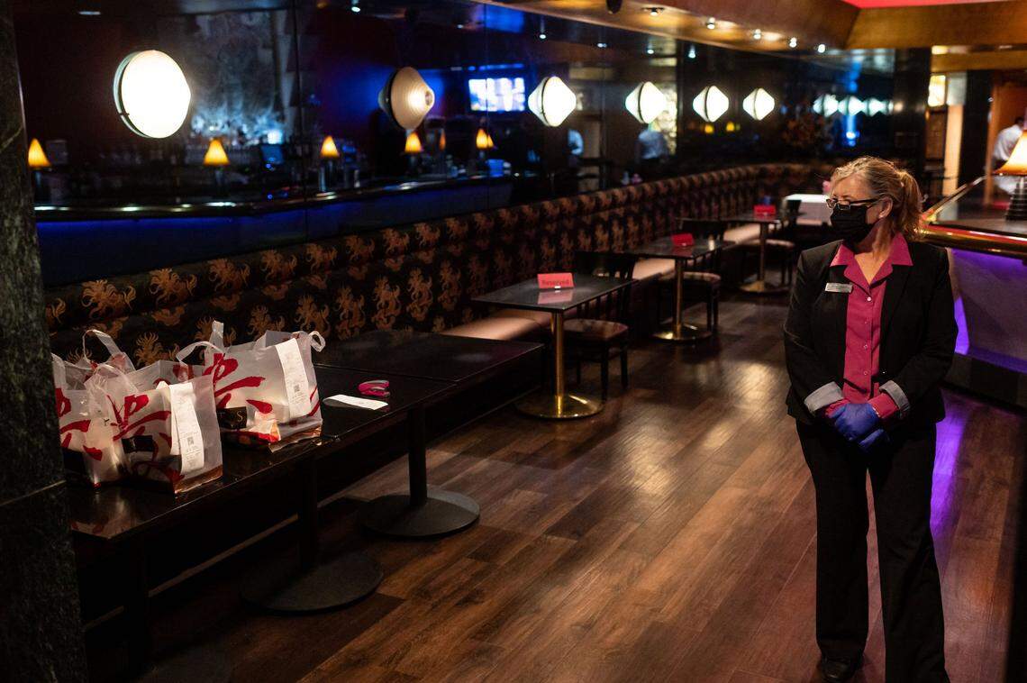 Nancy Rodgers, a manger at Frank Fats restaurant, looks over at finished takeout orders Friday, Oct. 30, 2020, in downtown Sacramento.