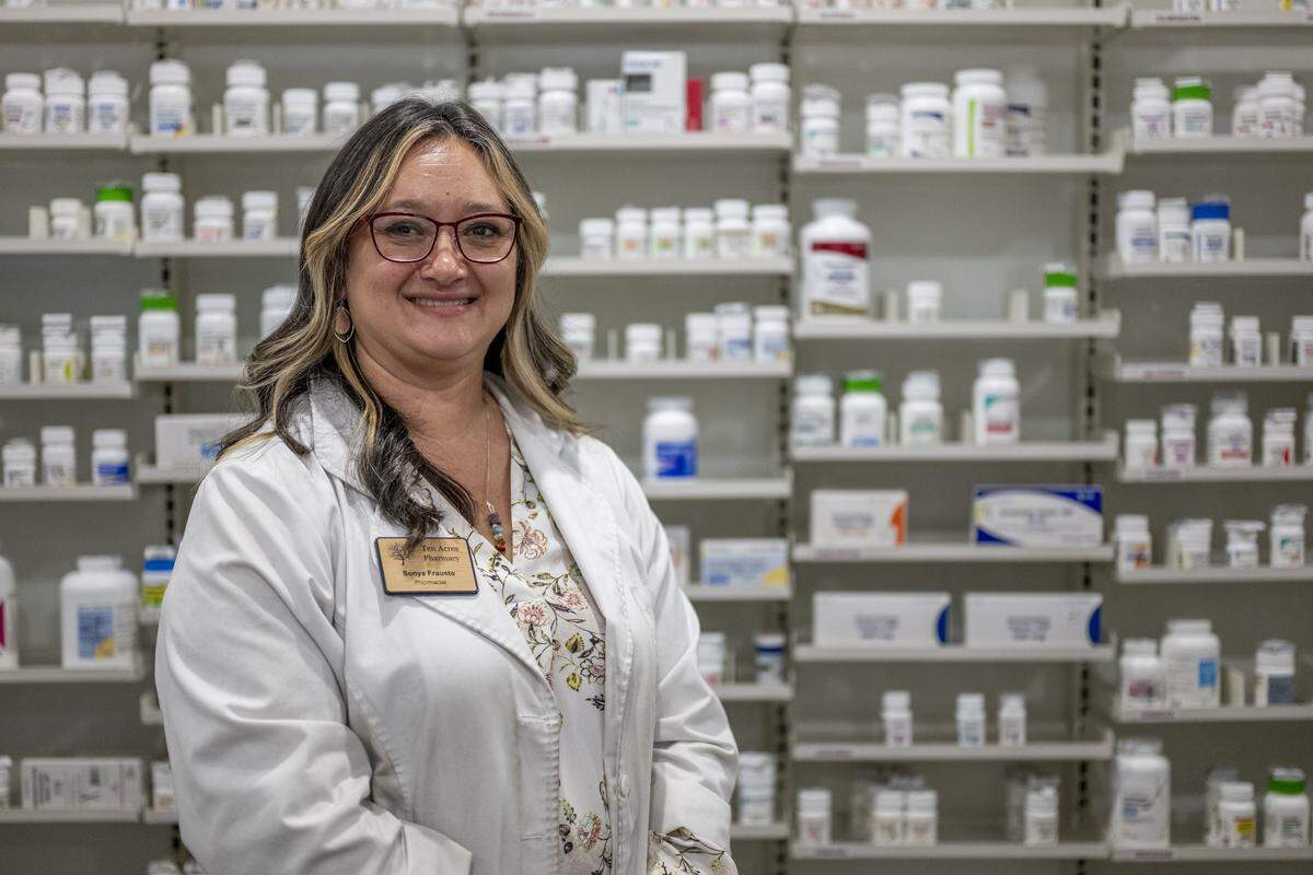 Sonya Frausto, pharmacist and owner of Ten Acres Pharmacy, poses for a portrait inside the store in Land Park on Thursday. She plans to close the business in August.