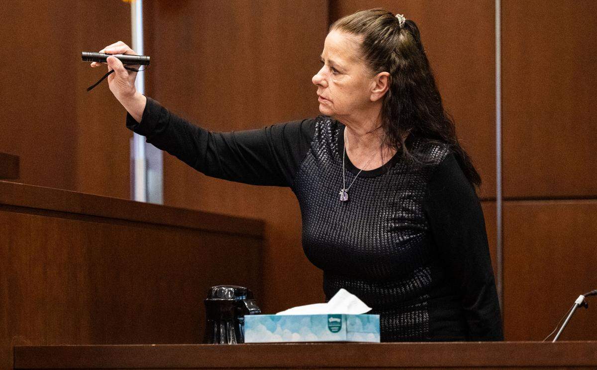 Stabbing victim Kimberlee Guillory uses a laser pointer, pointing to a map of the location of her tent on L Street in Davis when she was attacked, as she testifies on Wednesday during the trial of Carlos Reales Dominguez in Yolo Superior Court in Woodland.
