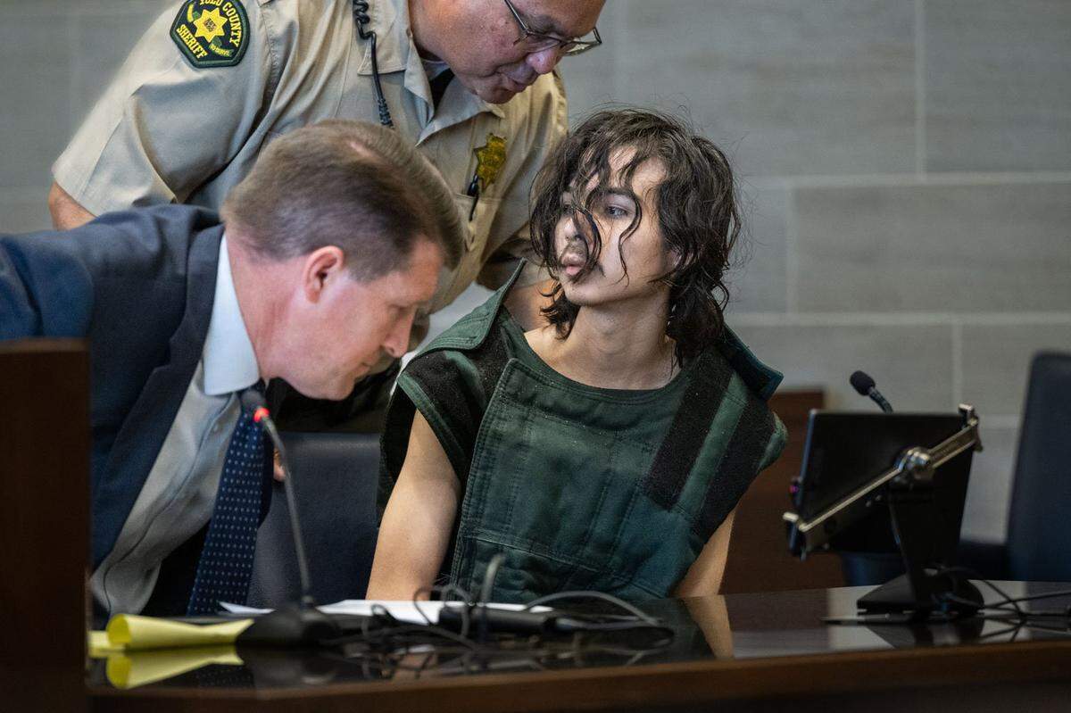 Carlos Reales Dominguez, who is charged with fatally stabbing two men in Davis and wounding a third victim, prepares to leave the courtroom after appearing before Yolo Superior Court Judge Samuel McAdam on Tuesday, June 6, 2023, with court-appointed public defender Dan Hutchinson.