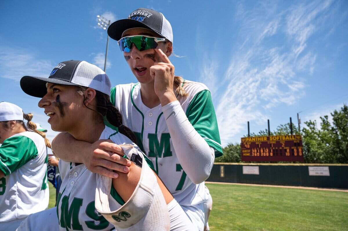 Dixon’s Brianna Humphries wipes her eye as she is carried by teammate Felesha LePenske after beating Marysville in the Division IV title softball game in 2022. LePenske is batting .478 this season for the No. 1-seed Rams, who have a first-round bye.
