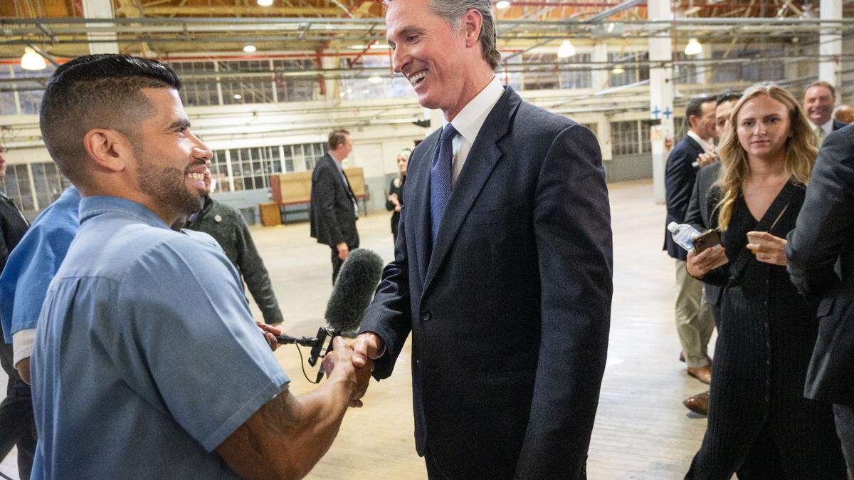 Ryan Pagan, an inmate at San Quentin State Prison, talks to Gov. Gavin Newsom on Friday. Newsom announced that by 2025, San Quentin will be converted from a maximum-security prison to a rehabilitation and education facility.