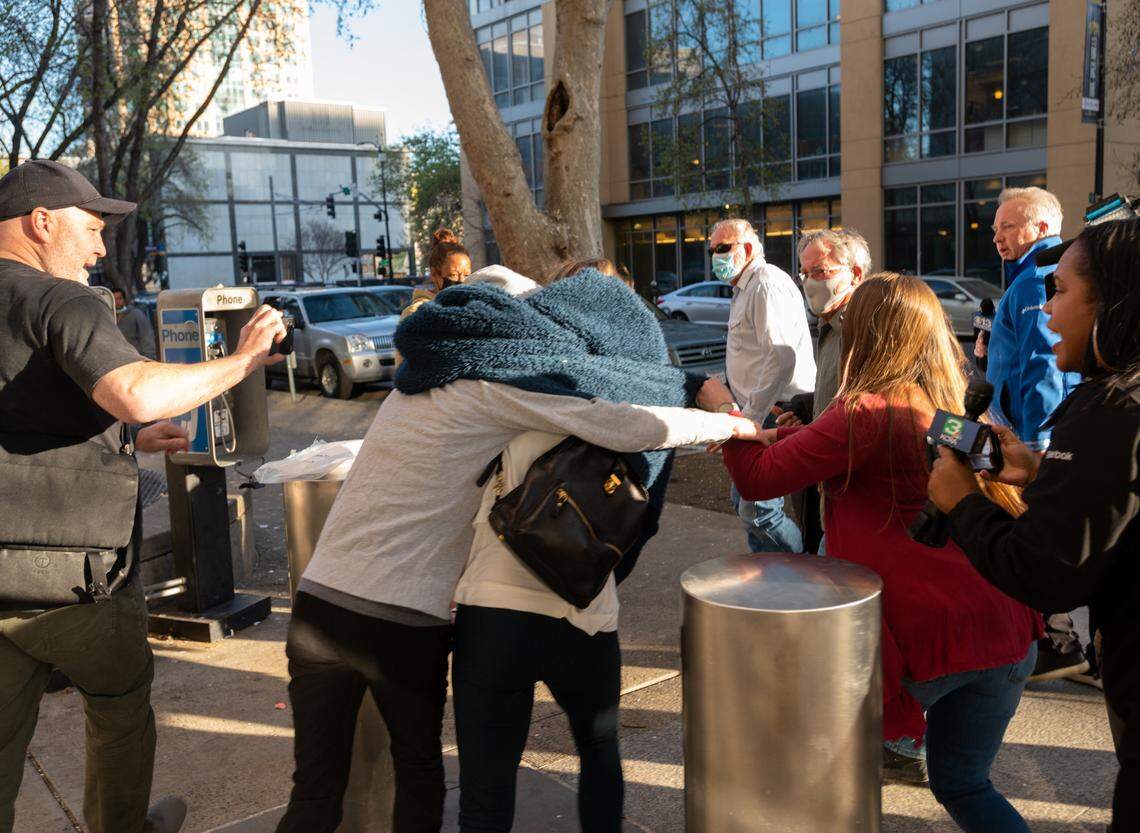 Sherri Papini is surrounded by family members after leaving the Sacramento County Main Jail on Tuesday, March 8, 2022. Papini, the Redding woman whose alleged kidnapping in November 2016 sparked national searches and tabloid media coverage, spent five nights in the jail after being arrested and charged with wire fraud and lying to federal agents about the abduction.
